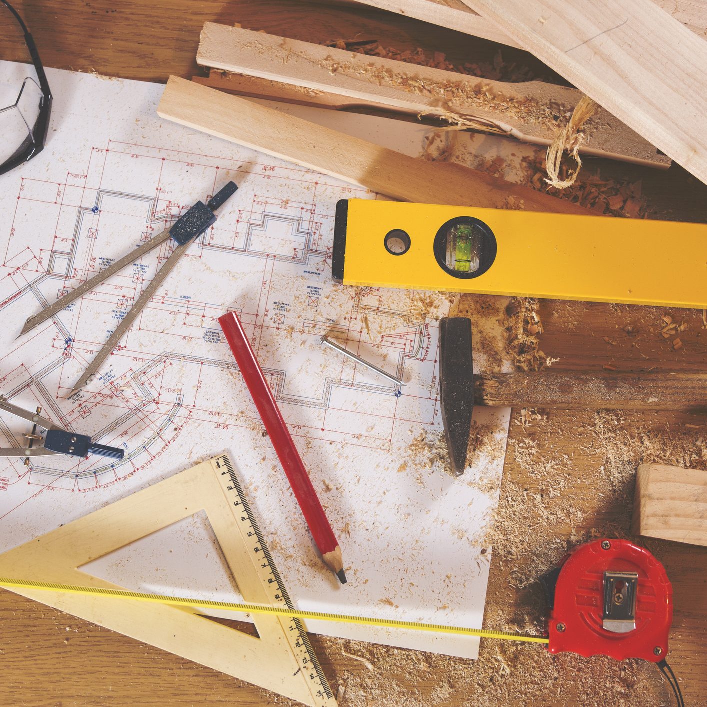 Carpenter tools on wooden background